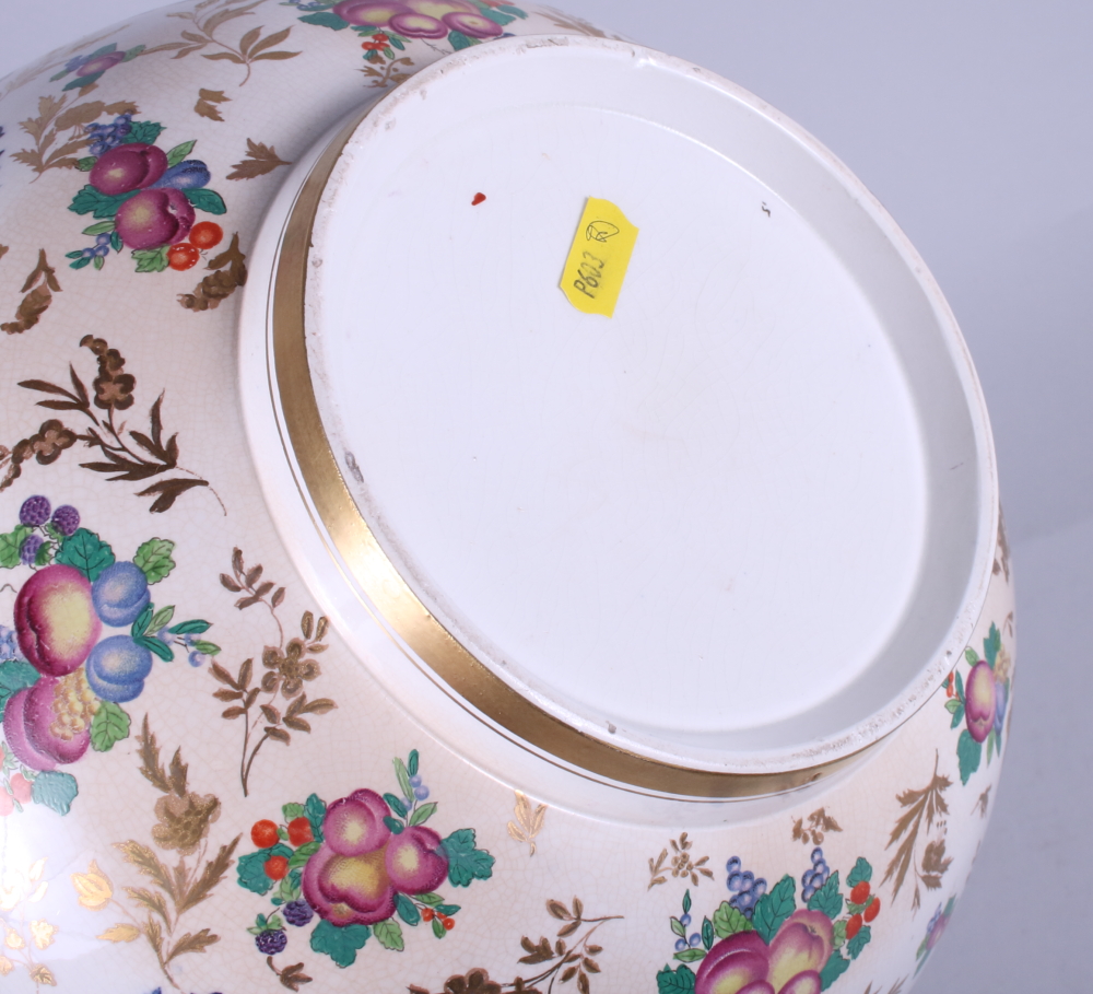 An early 20th century, possibly Booths, porcelain bowl, decorated with flowers and fruit, on a - Image 3 of 3