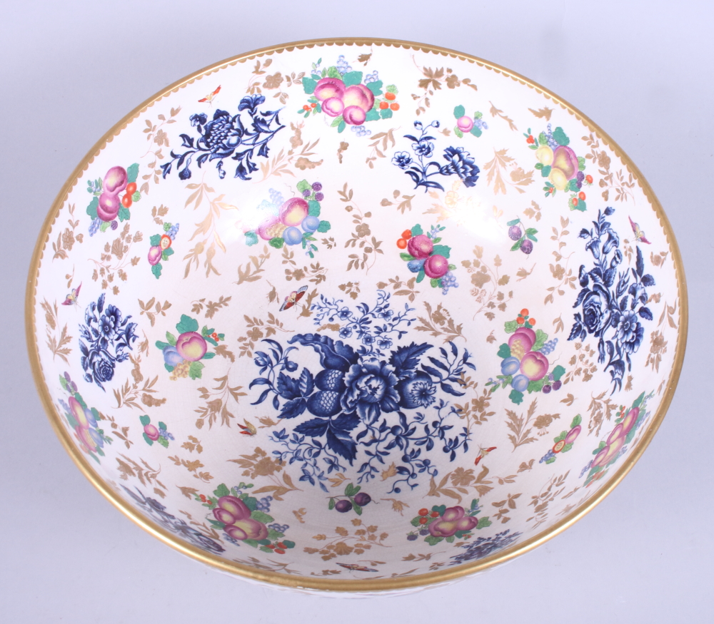 An early 20th century, possibly Booths, porcelain bowl, decorated with flowers and fruit, on a - Image 2 of 3