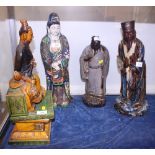 A Chinese pottery Jun glazed model of a standing scholar, together with three other Chinese