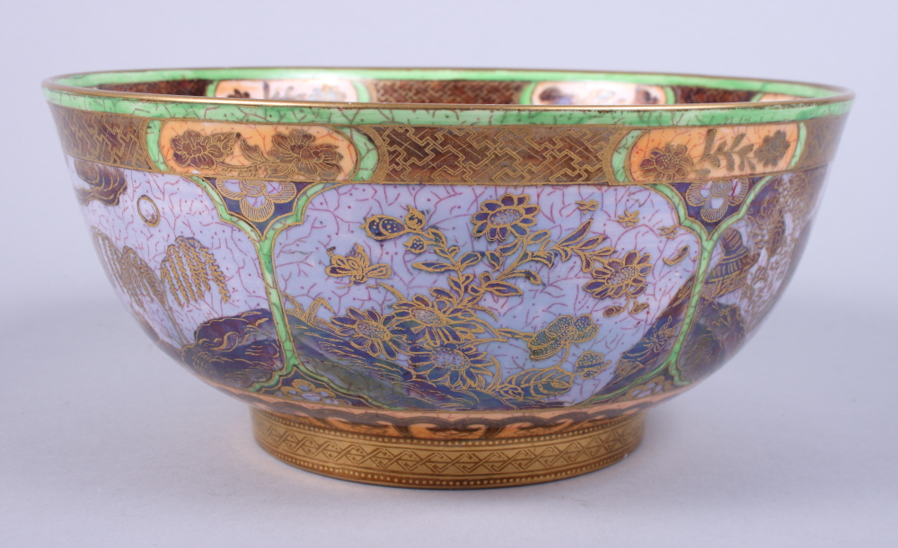 A Wedgwood lustre circular bowl, decorated with Chinese style landscapes, on gold painted