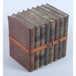 A Huntley & Palmer biscuit tin, in the form of eight leather bound books, "History of England,