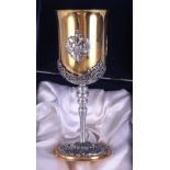 A gilt metal presentation goblet with white mounts and a Romanov eagle crest, 8" high