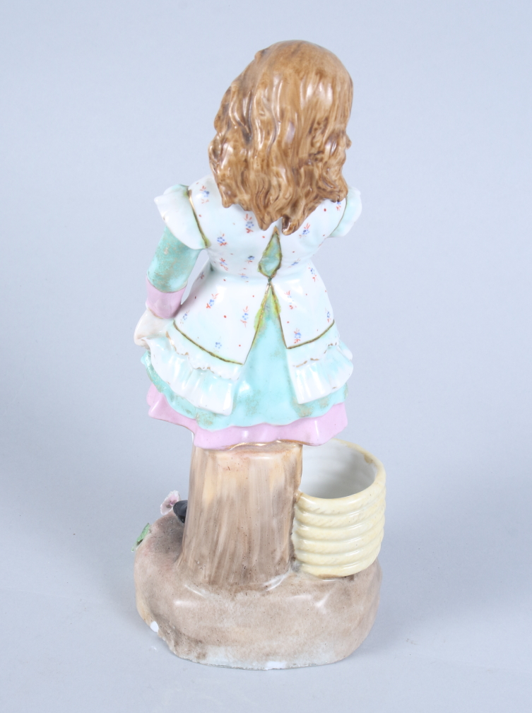 A late 19th century Continental porcelain figure of a girl standing by a coil of rope, 9 1/2" - Image 2 of 4