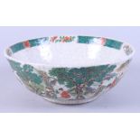 A Chinese porcelain famille rose crackle glaze bowl, enamelled with figures in garden scene,