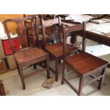 A set of four 19th century provincial oak bar back dining chairs with panel seats, on square taper