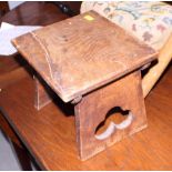 A quarter cut oak plank top stool, on panel end supports, 20" wide, and a 19th century mahogany