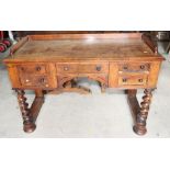 A 19th century mahogany kneehole desk with three-quarter gallery, five drawers and twist turned