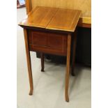 An Edwardian mahogany and walnut inlaid floor standing work table with twin hinged lid