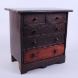 A 19th century mahogany miniature chest of two short and three long drawers, 12 1/2" wide