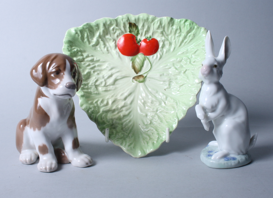 A Bing & Grondahl porcelain seated dog, a Lladro seated hare and a Carlton leaf moulded dish