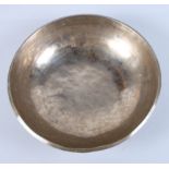 A Middle Eastern cast brass and silvered shallow dish with ring and dot decoration, 10" dia