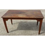 A late 19th century French cherrywood plank top table, on square taper supports, 27" x 50 1/2"