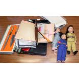 Three Chinese plastic dolls, dressed in the uniform of Red Guards, together with various textiles,