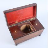 A 19th century mahogany and box strung sarcophagus tea caddy with fitted interior, on bun feet,