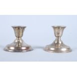A pair of silver candlesticks, on circular reeded stepped bases, Henry Hobson & Sons, Birmingham