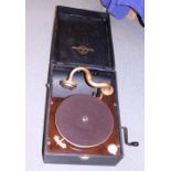 A Columbia portable record player and a collection of 78 rpm records, in carry case
