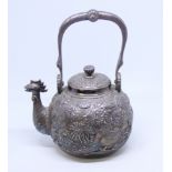 A Japanese white metal teapot with all-over floral decoration and cockerel spout, applied seal