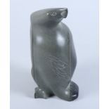 An Inuit mid 20th century hardstone carving of a bird with incised detail decoration, and Emikotalu,