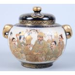 An early 20th century Satsuma lidded koro, decorated panels of figures, two gold painted elephant