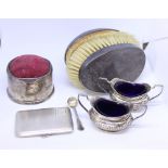 Two silver two-handled half-fluted salts, an engine turned cigarette case, a pair of silver backed