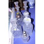 A mid 20th century cut glass and silver plated cocktail shaker and six cut glass decanters