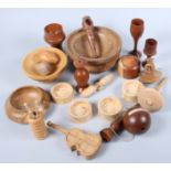 A treen oak spinning top, a cup and ball game, a three-dimensional jigsaw puzzle and other treen