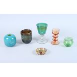 A Mdina glass goblet, two Mdina glass vases, a Wedgwood amber glass candlestick and two other pieces