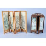 A Chinese hardwood three panel folding table screen, the panels decorated with figures painted on