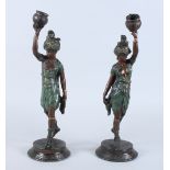 A pair of late 19th century cold painted spelter figures of "Turks", formed as candlesticks, 14"