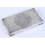 A mid 20th century Chinese white metal box and cover, decorated with a roundel of flying dragons and