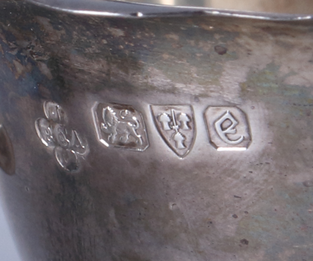 A mid Victorian silver sauceboat with scroll handle, on hoof feet supports, together with three - Bild 2 aus 2