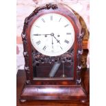 A mid 19th century mahogany bracket clock with eight-day striking movement in arch top case, on