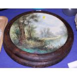 A pair of late 19th century landscape decorated pottery wall plaques, 14" dia, in walnut frames