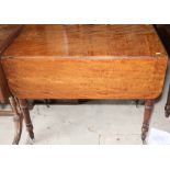 A 19th century mahogany Pembroke table, fitted end drawer, on turned supports, 35" wide