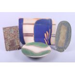 A studio pottery dish with green glaze, 9" dia, a similar rectangular dish and two other pieces of