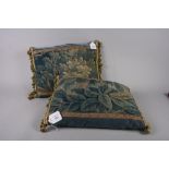 A pair of 18th century Aubusson verdure tapestry fragments, now cushions, 16" wide