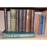 Twelve hard back books, including Daniel Dafoe: "Robinson Crusoe", H G Wells: "Bealby" and "The