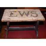 A 19th century pine stool with E W S initials, 15" wide