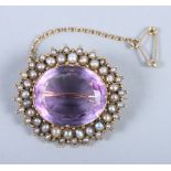 A 19th century yellow metal brooch set amethyst and seed pearls