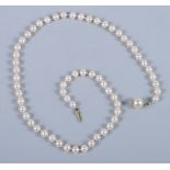 A cultured pearl necklace with 18ct gold mounted pearl clasp, 17" long