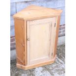 A pine corner cupboard enclosed panel door, 26" wide