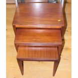 A nest of three mid 20th century Danish coffee tables, on square tapered supports