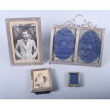 A George V silver double aperture photograph frame with easel back and three other silver photograph