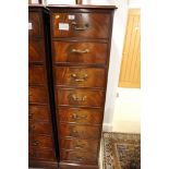 *A mahogany four drawer filing cabinet with brass drop handles, on block base, 17" wide x 27" deep x