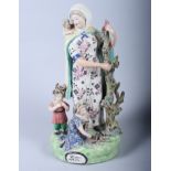 An 18th century Staffordshire figure, "Widow and Orphans", 11" high (restorations)