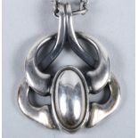 A Georg Jensen silver pendant, marks for 2006, 1 1/8" long, of Heritage design, on a tracelink