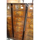 *A mahogany four drawer filing cabinet with brass drop handles, on block base, 17" wide x 27" deep x