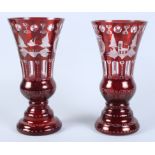 A pair of Continental ruby flashed and engraved wasted vases with landscape decoration, 12" high