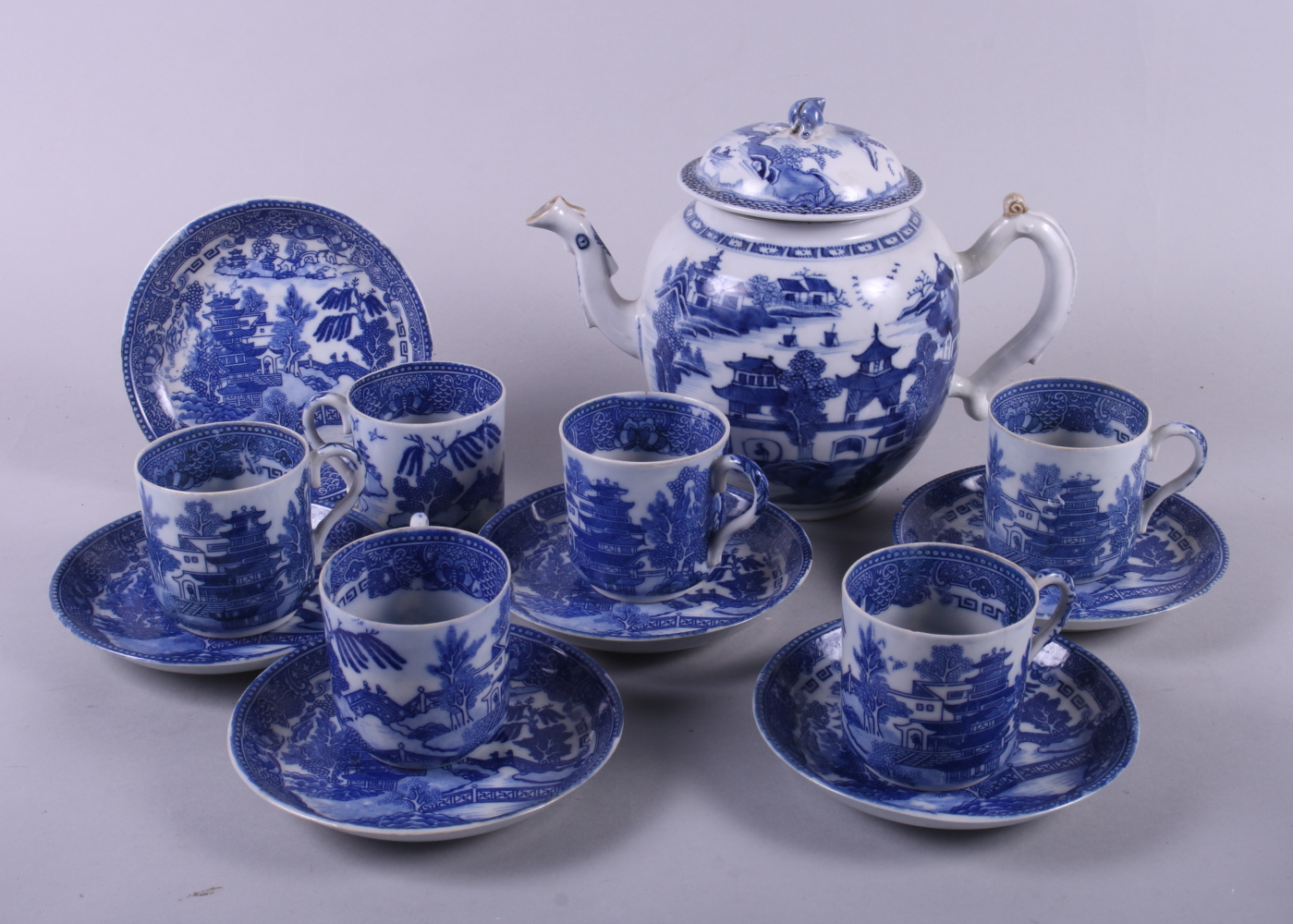 An early 20th century Chinese exportware blue and white porcelain "Willow" pattern porcelain tea