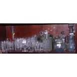 A pair of cut glass decanters and stoppers, an engraved wine glass cooler, a collection of
